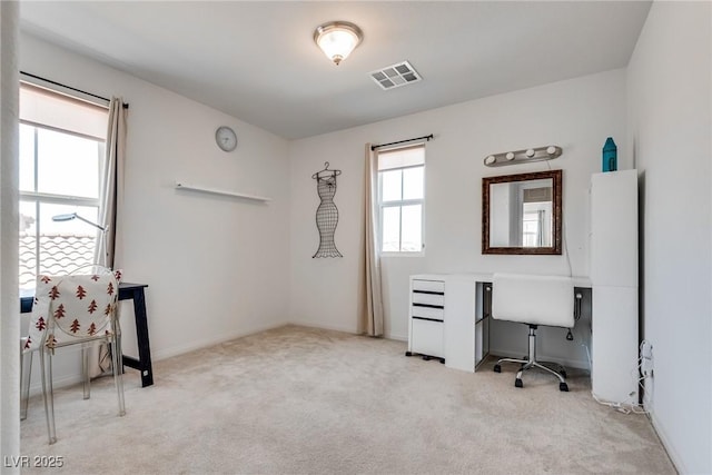 office featuring visible vents, baseboards, and carpet flooring