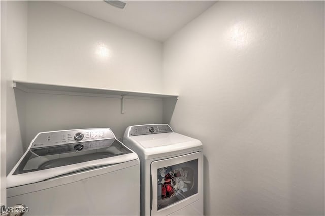 clothes washing area featuring washing machine and clothes dryer