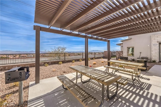 view of patio featuring a pergola and a mountain view