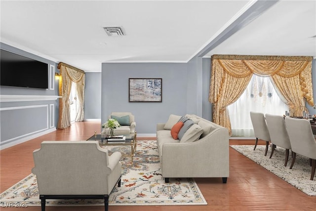 1301 E St Louis Ave Unit C, Las Vegas, NV 89104 - living room with wood finished floors, ornamental molding, and baseboards