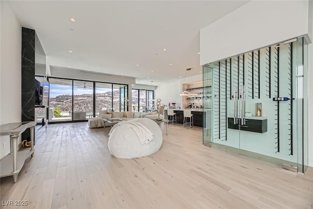 living area with recessed lighting and wood finished floors