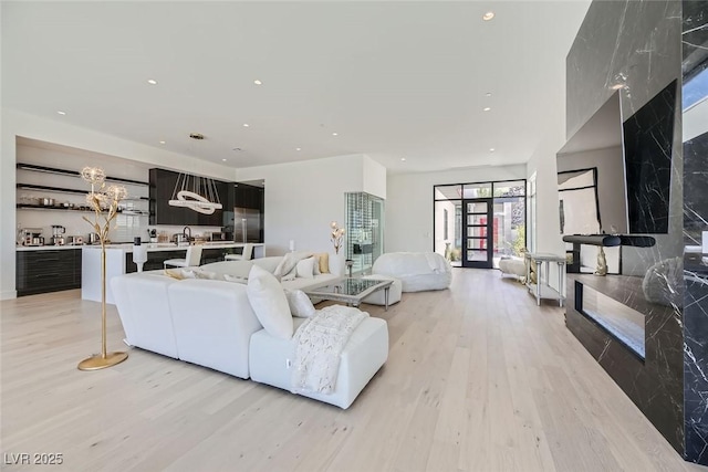 living room featuring recessed lighting and light wood-style floors