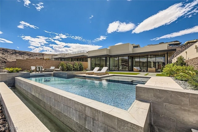 view of swimming pool with a patio, fence, and a fenced in pool