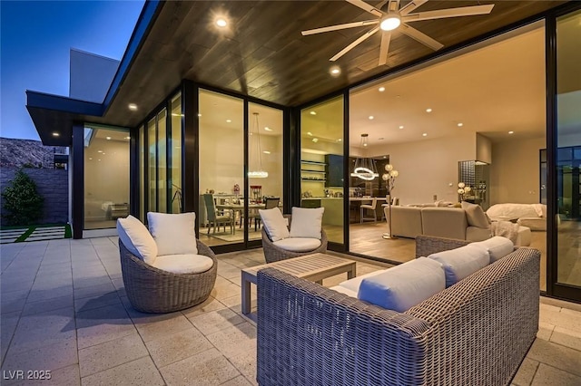 view of patio with an outdoor hangout area and a ceiling fan