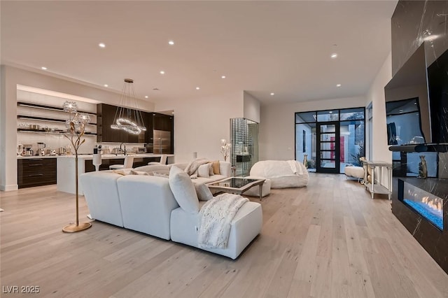 living area featuring recessed lighting and light wood-style floors