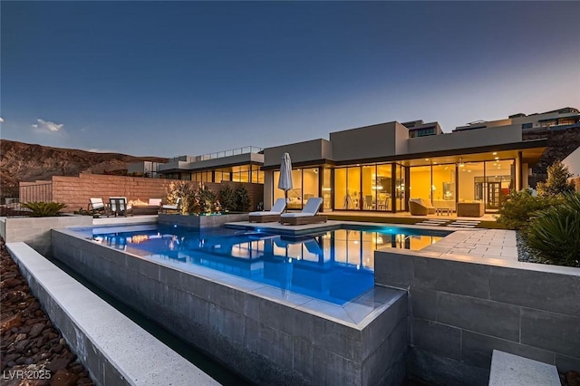 view of pool featuring a fenced in pool, fence, and a patio area