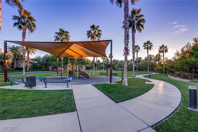 view of community featuring a lawn and playground community