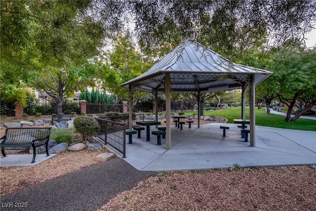 surrounding community featuring a gazebo and fence