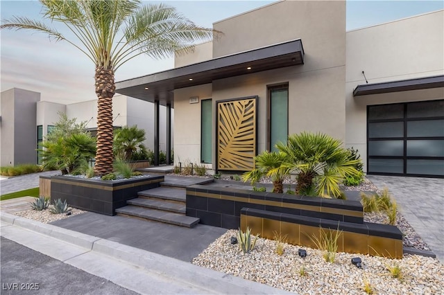 property entrance featuring stucco siding