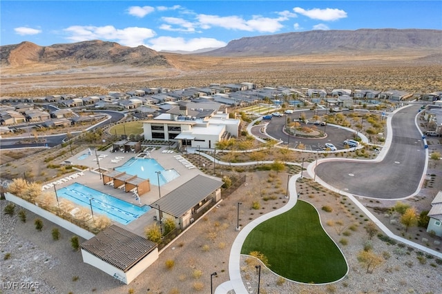 birds eye view of property featuring a mountain view