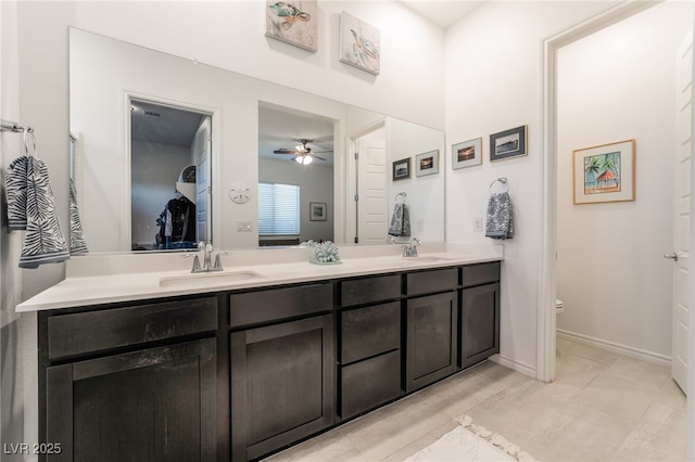 bathroom with ceiling fan, vanity, and toilet