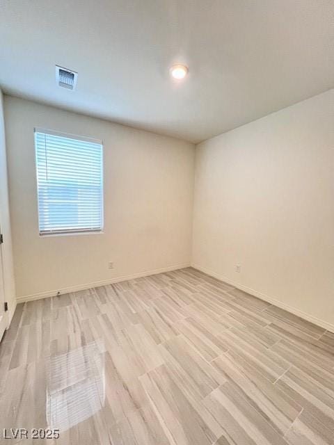 unfurnished room featuring light hardwood / wood-style flooring