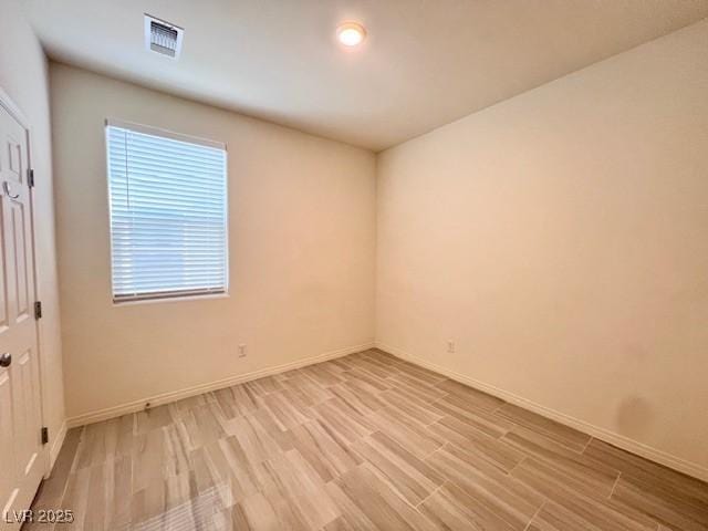 unfurnished room featuring light wood-type flooring