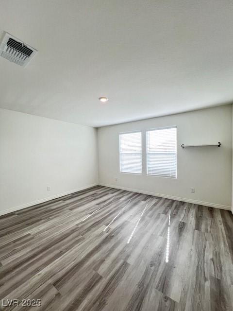 empty room featuring hardwood / wood-style floors