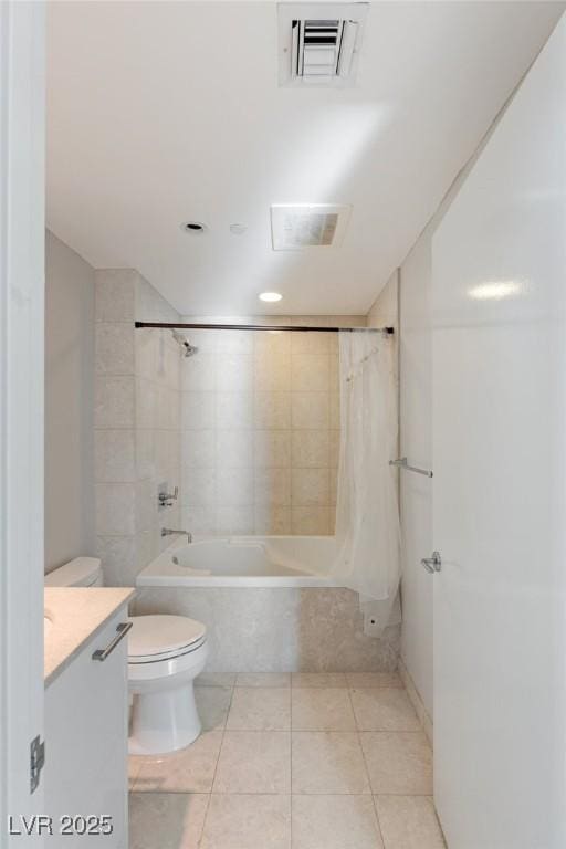 full bathroom featuring vanity, tile patterned flooring, toilet, and shower / bath combo with shower curtain