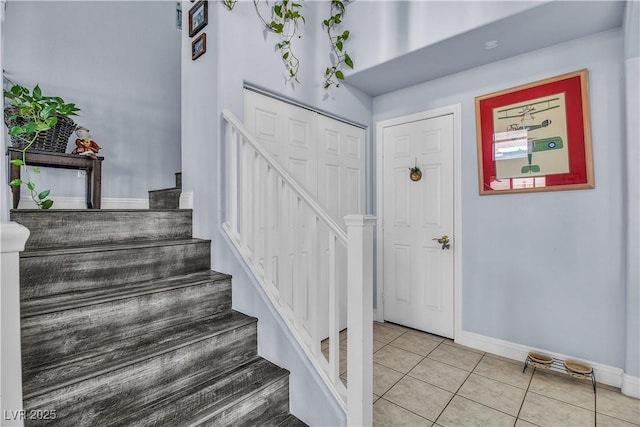 stairs featuring tile patterned floors