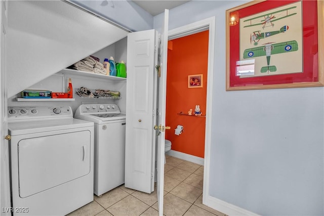 laundry room with light tile patterned flooring and separate washer and dryer