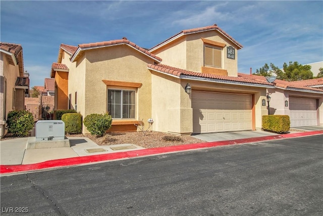 mediterranean / spanish house with a garage