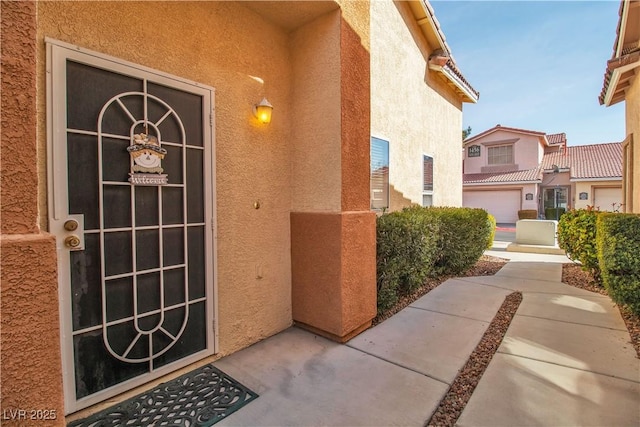 doorway to property featuring a garage