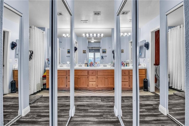 bathroom featuring vanity and hardwood / wood-style floors