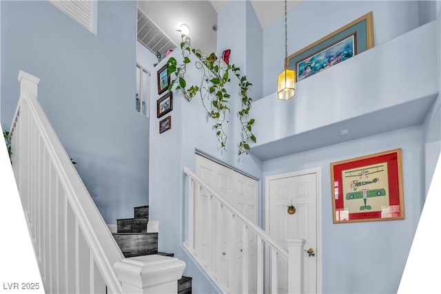 stairs with a high ceiling