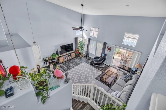 living room featuring high vaulted ceiling, ceiling fan, and hardwood / wood-style flooring