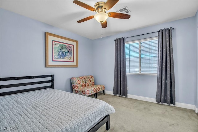 bedroom featuring ceiling fan and light carpet