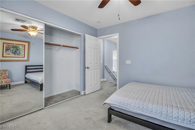 carpeted bedroom with a closet and ceiling fan