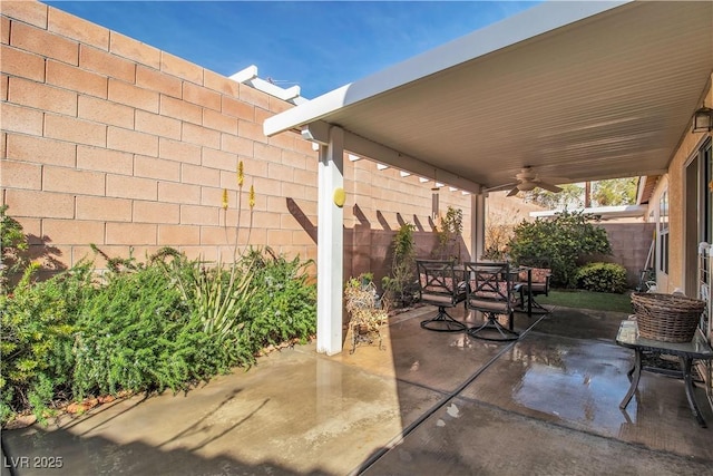 view of patio featuring ceiling fan