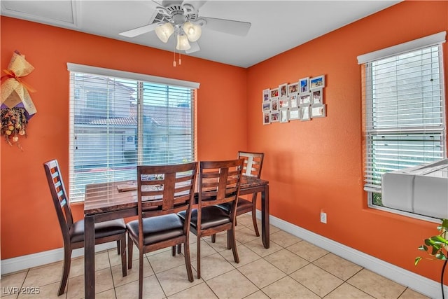 tiled dining area featuring ceiling fan