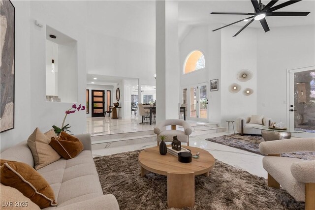4961 Tierra Del Sol Dr, Las Vegas, NV 89113 - living room with a high ceiling, marble tiled flooring, and ceiling fan