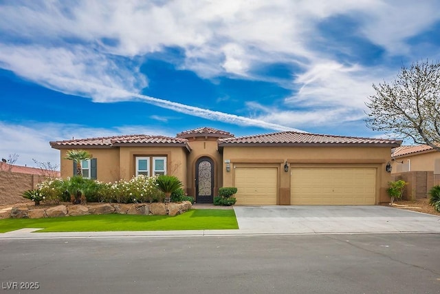 mediterranean / spanish home featuring a garage, driveway, a tiled roof, and stucco siding