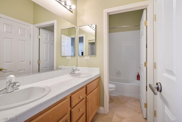 bathroom with tile patterned flooring, a sink, toilet, and double vanity