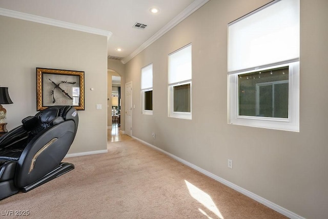 office with baseboards, visible vents, arched walkways, light colored carpet, and crown molding