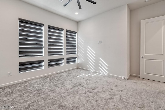 empty room featuring light carpet and ceiling fan