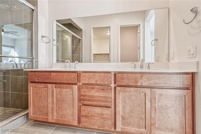 bathroom with vanity, tile patterned flooring, and an enclosed shower