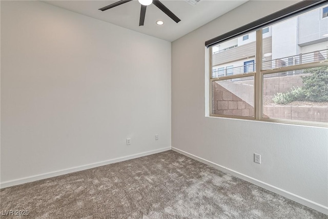 unfurnished room featuring carpet floors and ceiling fan