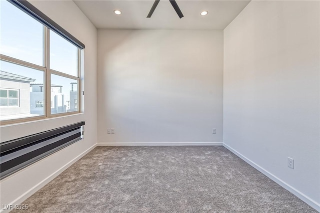 carpeted empty room with ceiling fan