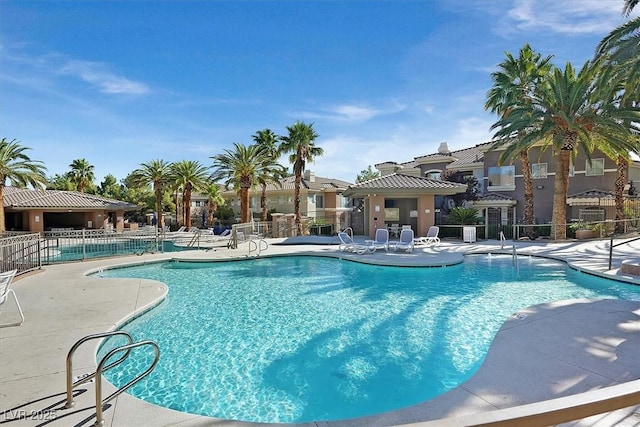 view of swimming pool featuring a patio area