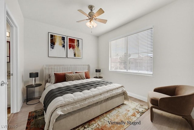 bedroom featuring ceiling fan and wood-type flooring