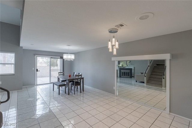 6250 W Flamingo Rd Unit 7, Las Vegas, NV 89103 - tiled dining area with a notable chandelier