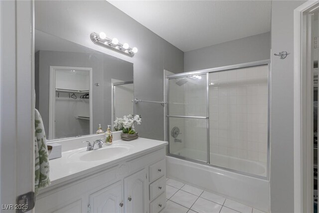 6250 W Flamingo Rd Unit 7, Las Vegas, NV 89103 - bathroom with tile patterned flooring, vanity, and enclosed tub / shower combo