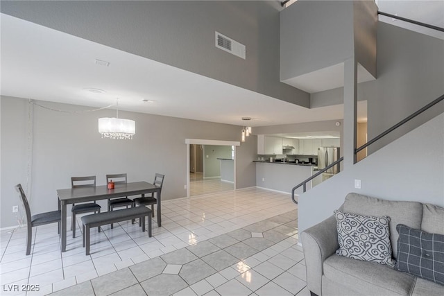 6250 W Flamingo Rd Unit 7, Las Vegas, NV 89103 - tiled dining space featuring an inviting chandelier