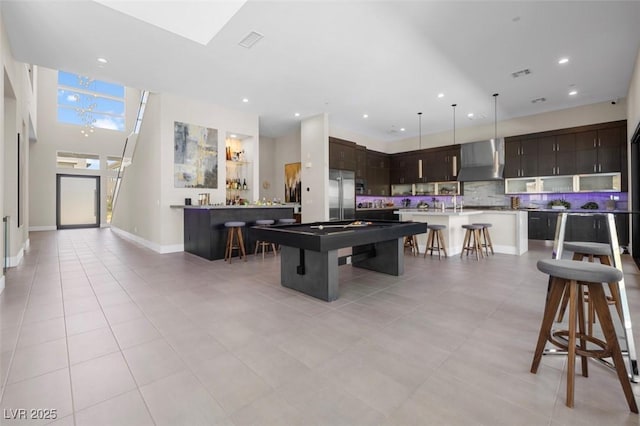 recreation room featuring light tile patterned flooring, recessed lighting, indoor bar, billiards, and baseboards