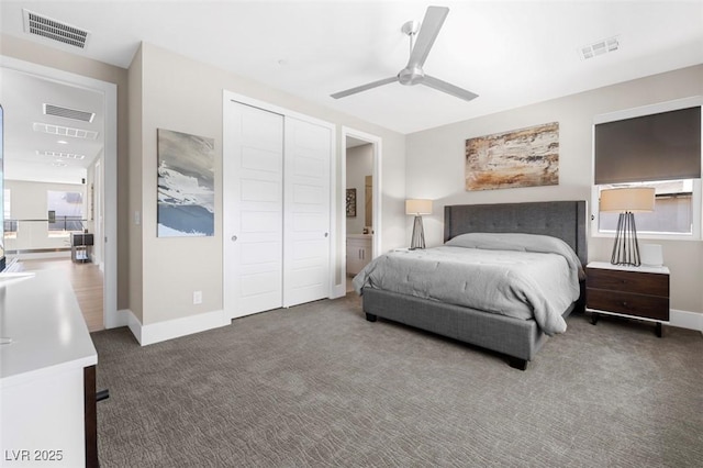 carpeted bedroom featuring a closet, visible vents, ceiling fan, and baseboards