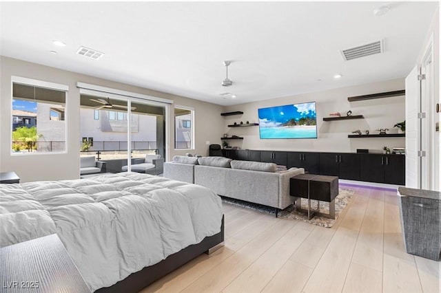 bedroom featuring light wood-style floors, recessed lighting, visible vents, and access to exterior