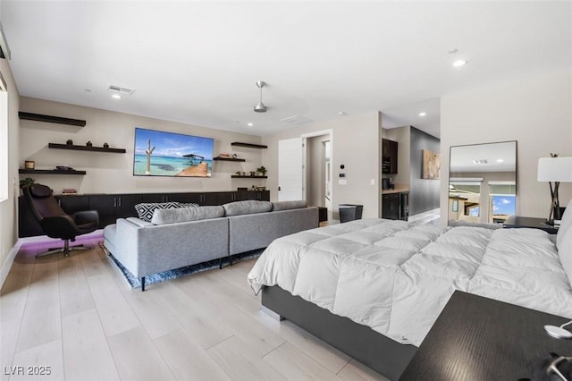 bedroom with light wood-style flooring and recessed lighting