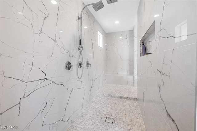 full bath with a marble finish shower and visible vents