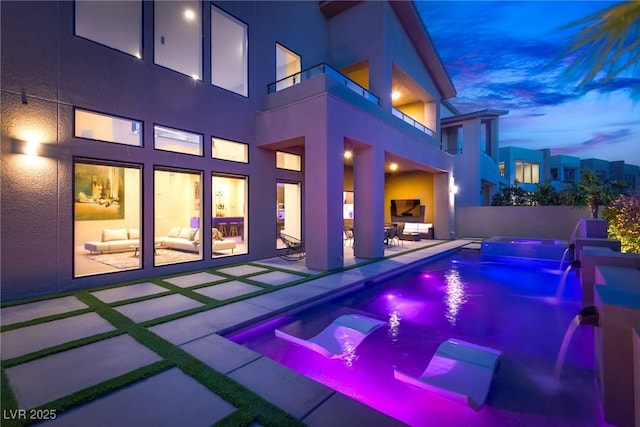 view of swimming pool with a fenced in pool, a patio, and an in ground hot tub