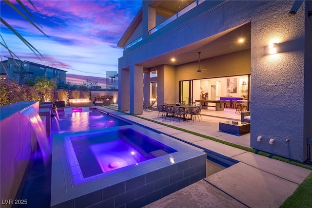 pool with ceiling fan, a patio, outdoor dining area, an in ground hot tub, and an outdoor living space